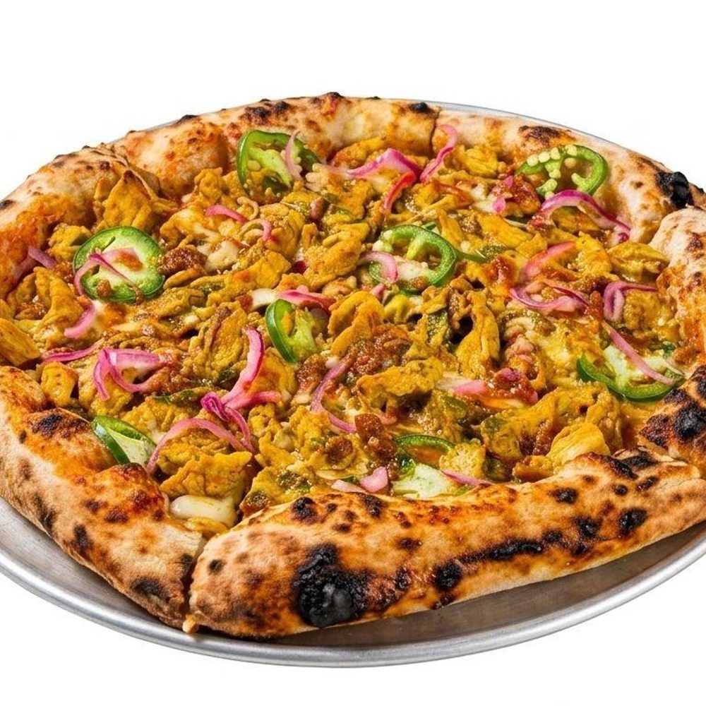 Chicken Tikka pizza topped with jalapeño and pickled red onion